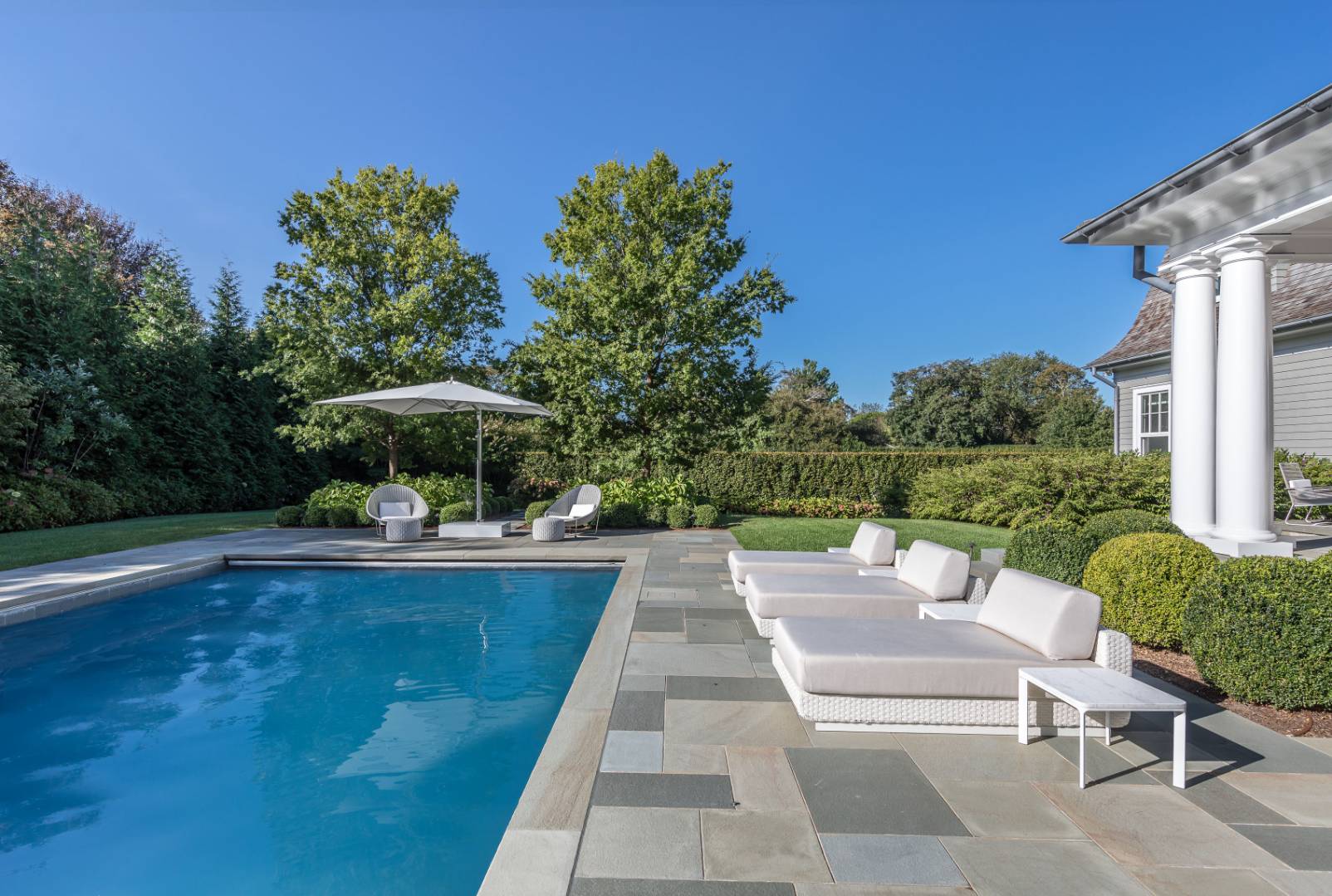 8 Hither Lane East Hampton, NY 11937 - Photo 34 of 38 a view of swimming pool with outdoor seating and plants