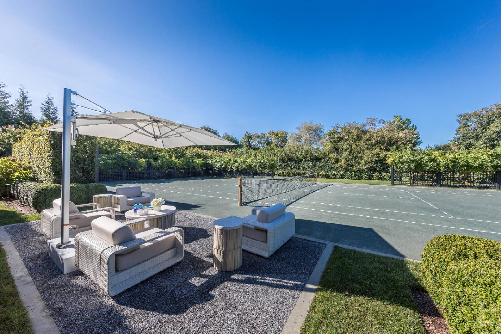 8 Hither Lane East Hampton, NY 11937 - Photo 35 of 38 a view of a patio with couches chairs and a table