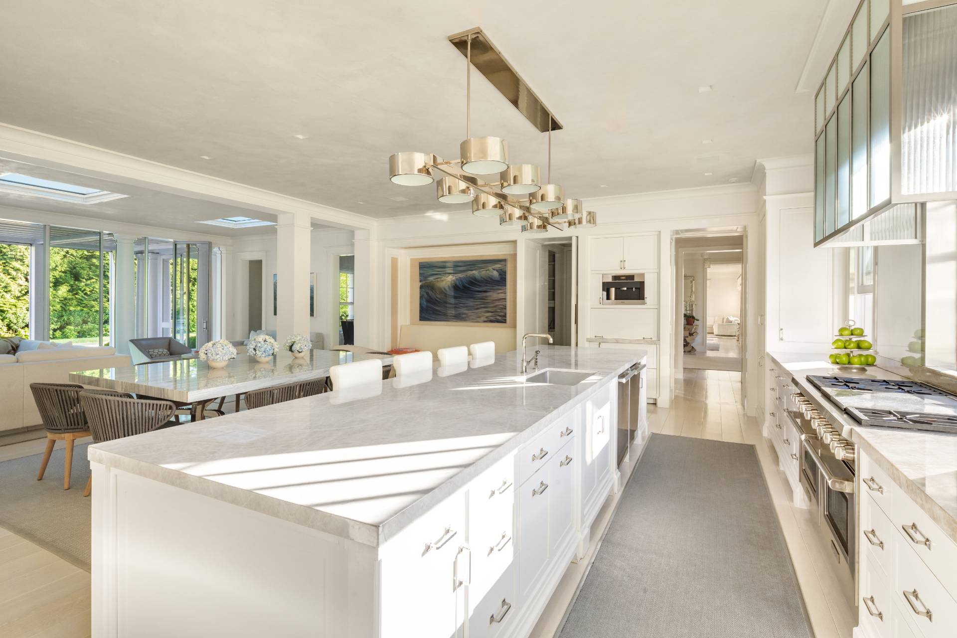 8 Hither Lane East Hampton, NY 11937 - Photo 8 of 38 a large kitchen with kitchen island a large island in it