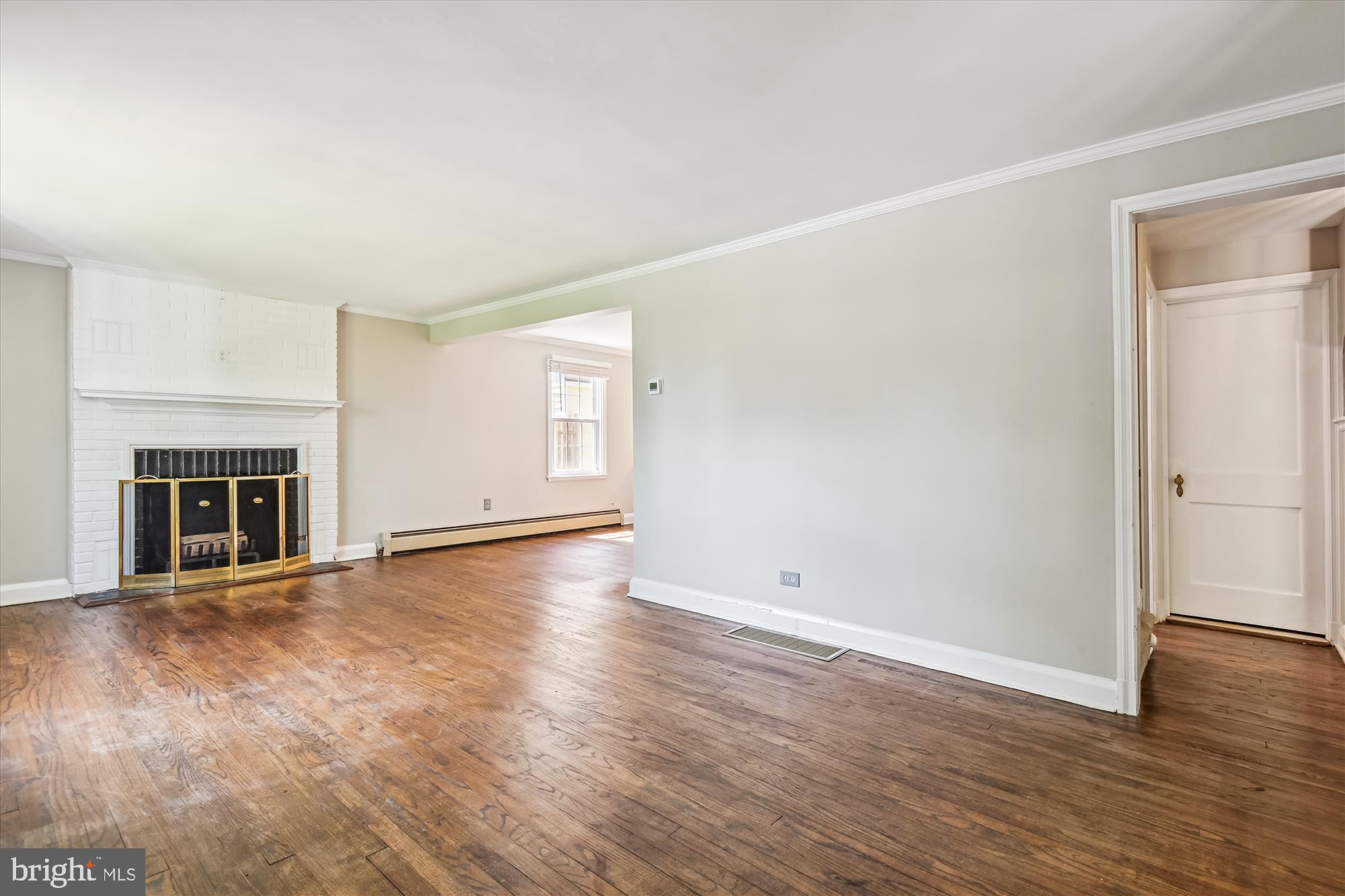 1402 Ruxton Road Baltimore, MD 21204 - Photo 3 of 32 A wood burning fireplace and warm hardwood floors