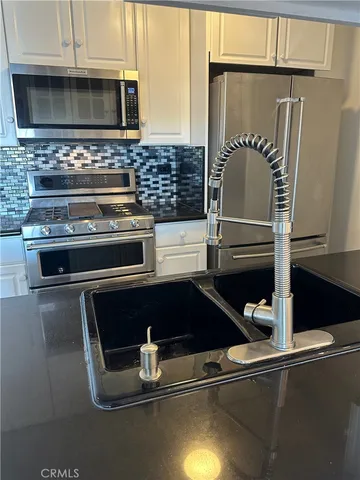 a kitchen with a stove and a microwave