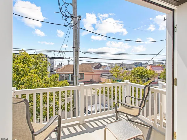 a view of a balcony with chairs