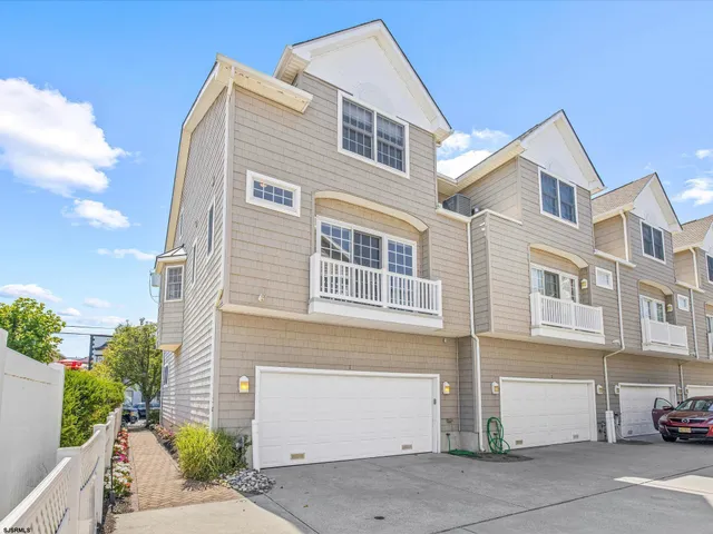 a front view of a house with a garage