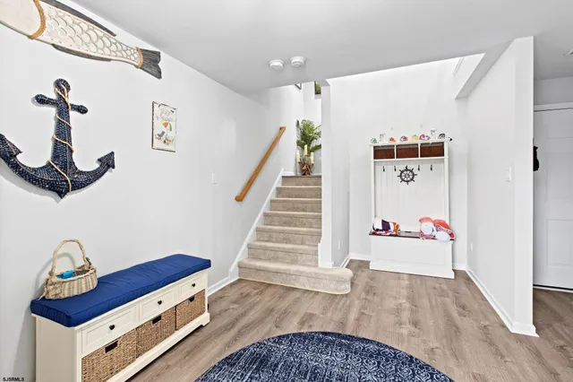 a view of entryway with wooden floor