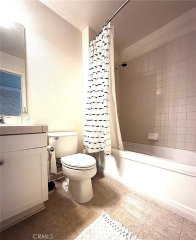 a bathroom with a toilet a sink and a bathtub