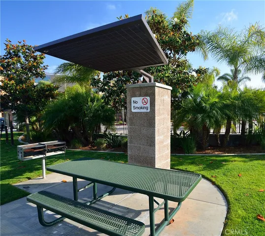a view of a chairs and table in the garden