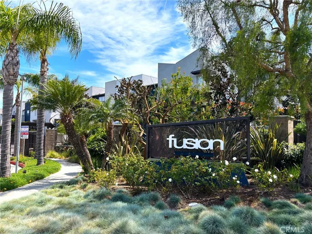 a sign that is sitting in front of a house