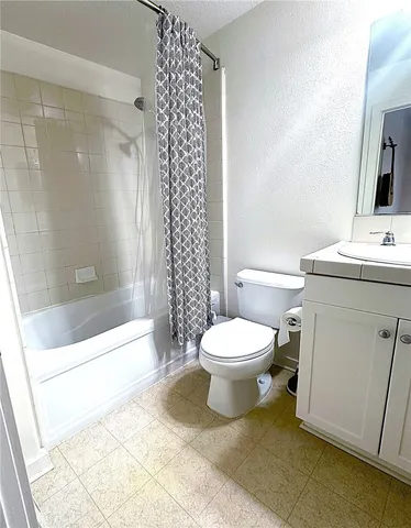 a bathroom with a toilet a sink and a bathtub
