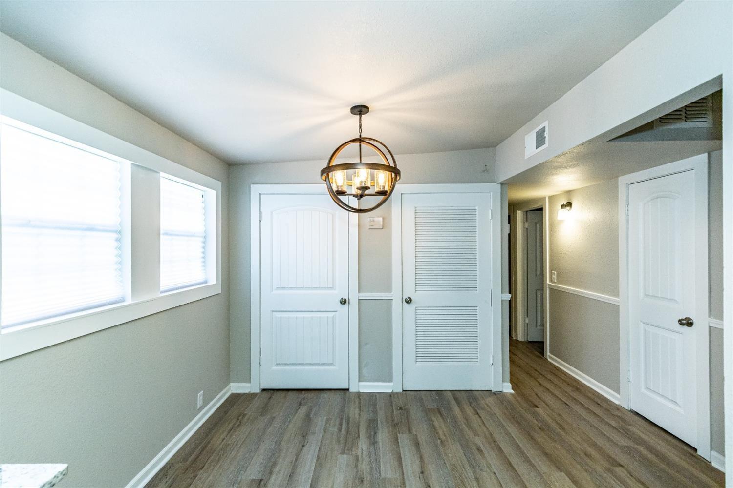 2723 66th Street Lubbock, TX 79413 - Photo 7 of 17 a view of hallway with wooden floor