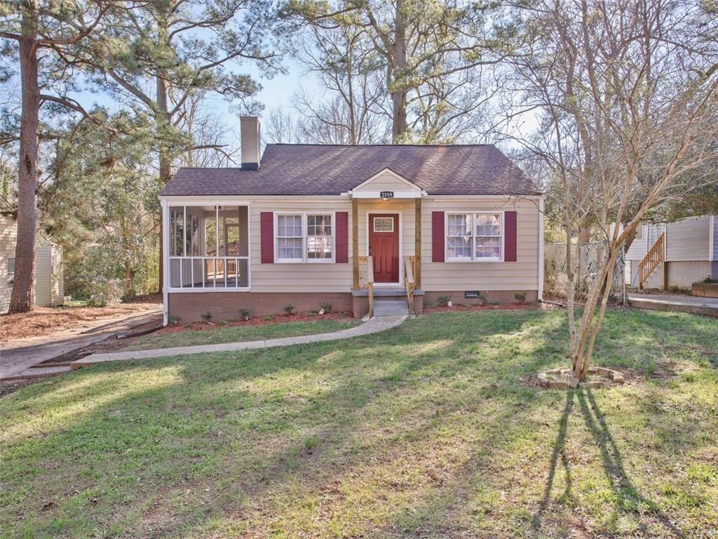 a front view of a house with a yard