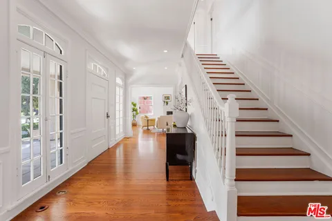 a spacious bedroom with a bed and a fireplace