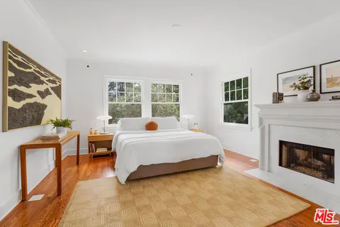 a bathroom with bathtub and window
