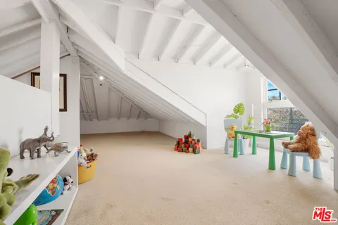 a balcony with wooden floor and trees