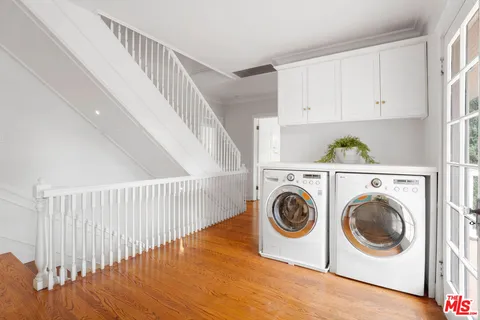 a view of a pathway with a flower garden