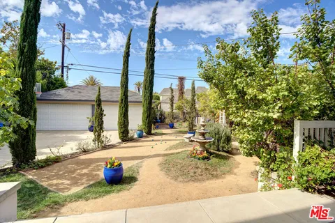 a view of a chairs and table in the patio