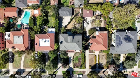 an aerial view of multiple houses with yard