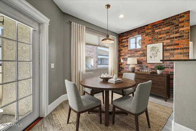 a view of a dining room with furniture window and wooden floor