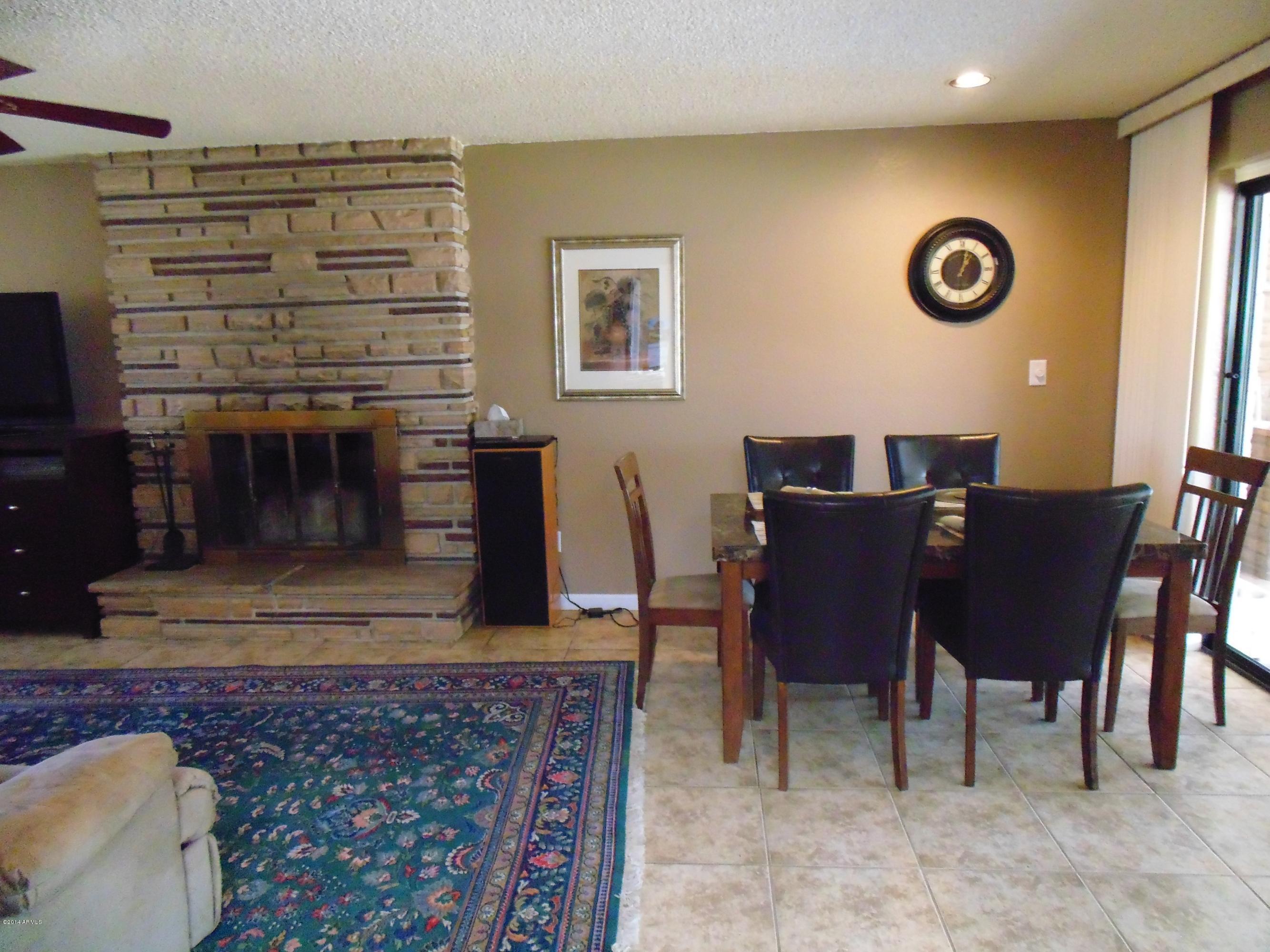 1518 North Power Road Mesa, AZ 85205 - Photo 14 of 22 dining area by fireplace