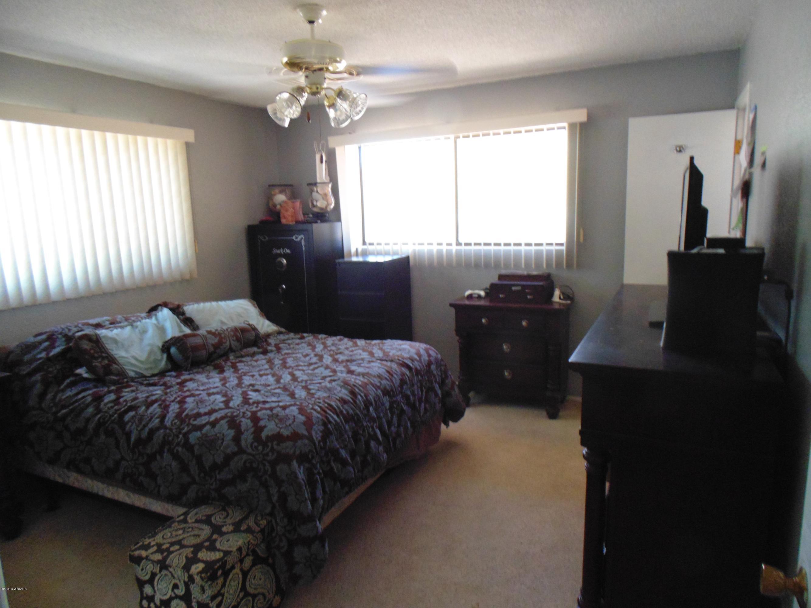 1518 North Power Road Mesa, AZ 85205 - Photo 19 of 22 master bedroom view from hallway