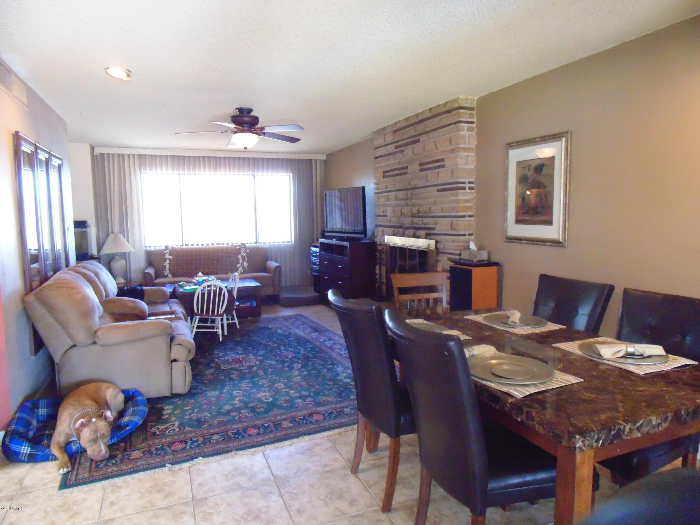 1518 North Power Road Mesa, AZ 85205 - Photo 9 of 22 great room with fireplace and dining are