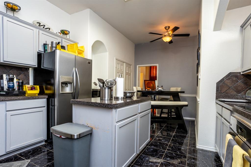 928 Trinity Drive Lancaster, TX 75146 - Photo 11 of 31 a kitchen with a sink appliances and cabinets