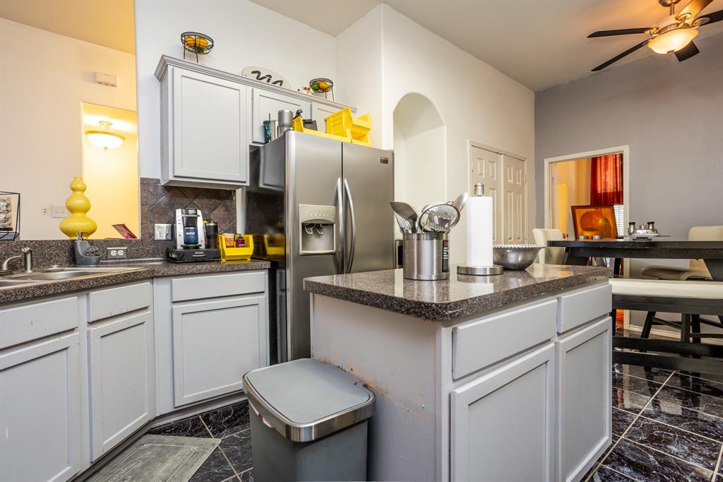 928 Trinity Drive Lancaster, TX 75146 - Photo 13 of 31 a kitchen with a sink cabinets and appliances