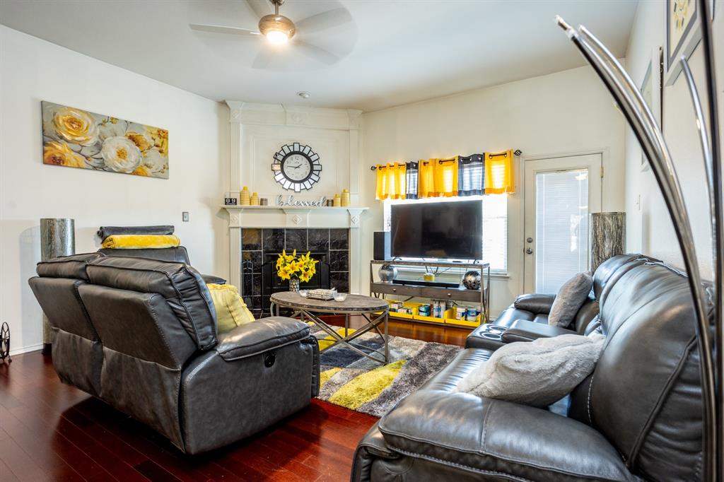 928 Trinity Drive Lancaster, TX 75146 - Photo 15 of 31 a living room with furniture and a flat screen tv