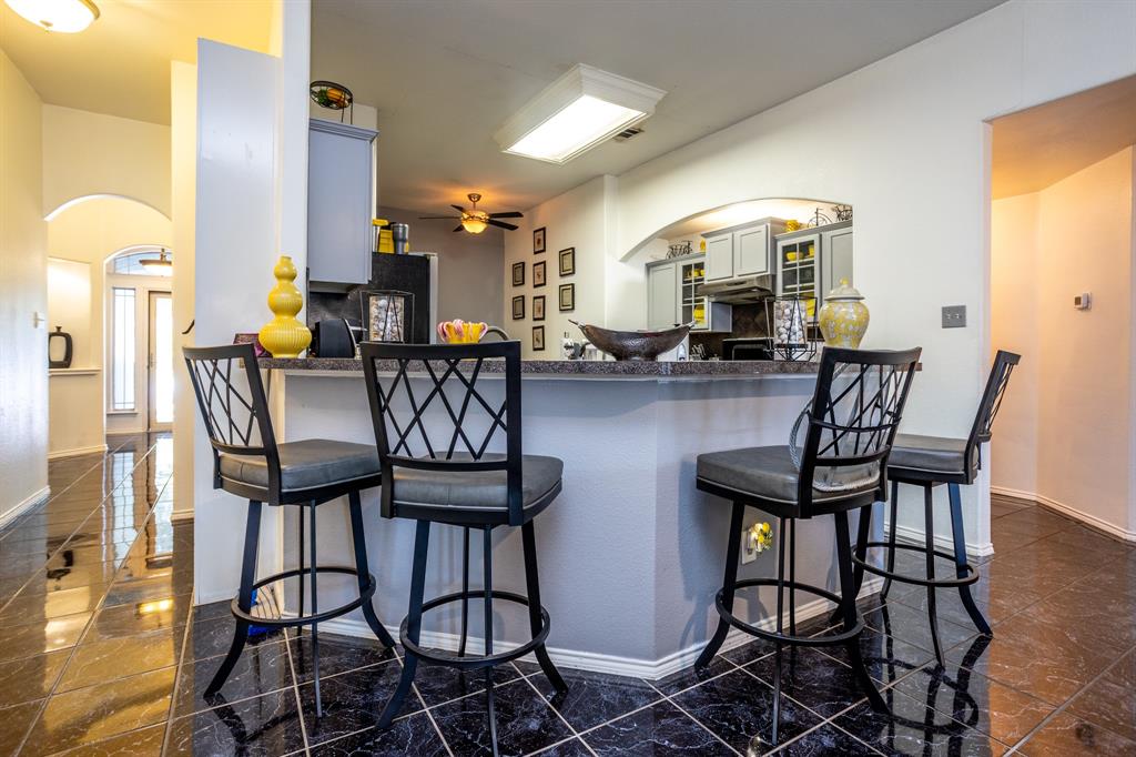 928 Trinity Drive Lancaster, TX 75146 - Photo 16 of 31 a dining room with furniture and wooden floor