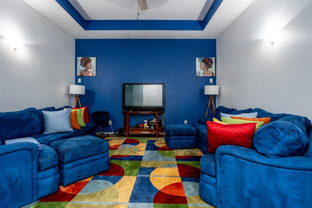 928 Trinity Drive Lancaster, TX 75146 - Photo 18 of 31 a living room with furniture and a lamp