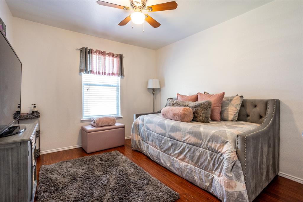 928 Trinity Drive Lancaster, TX 75146 - Photo 20 of 31 a spacious bedroom with a bed and a window