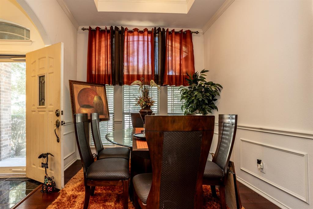 928 Trinity Drive Lancaster, TX 75146 - Photo 7 of 31 a view of a dining room with furniture and a window