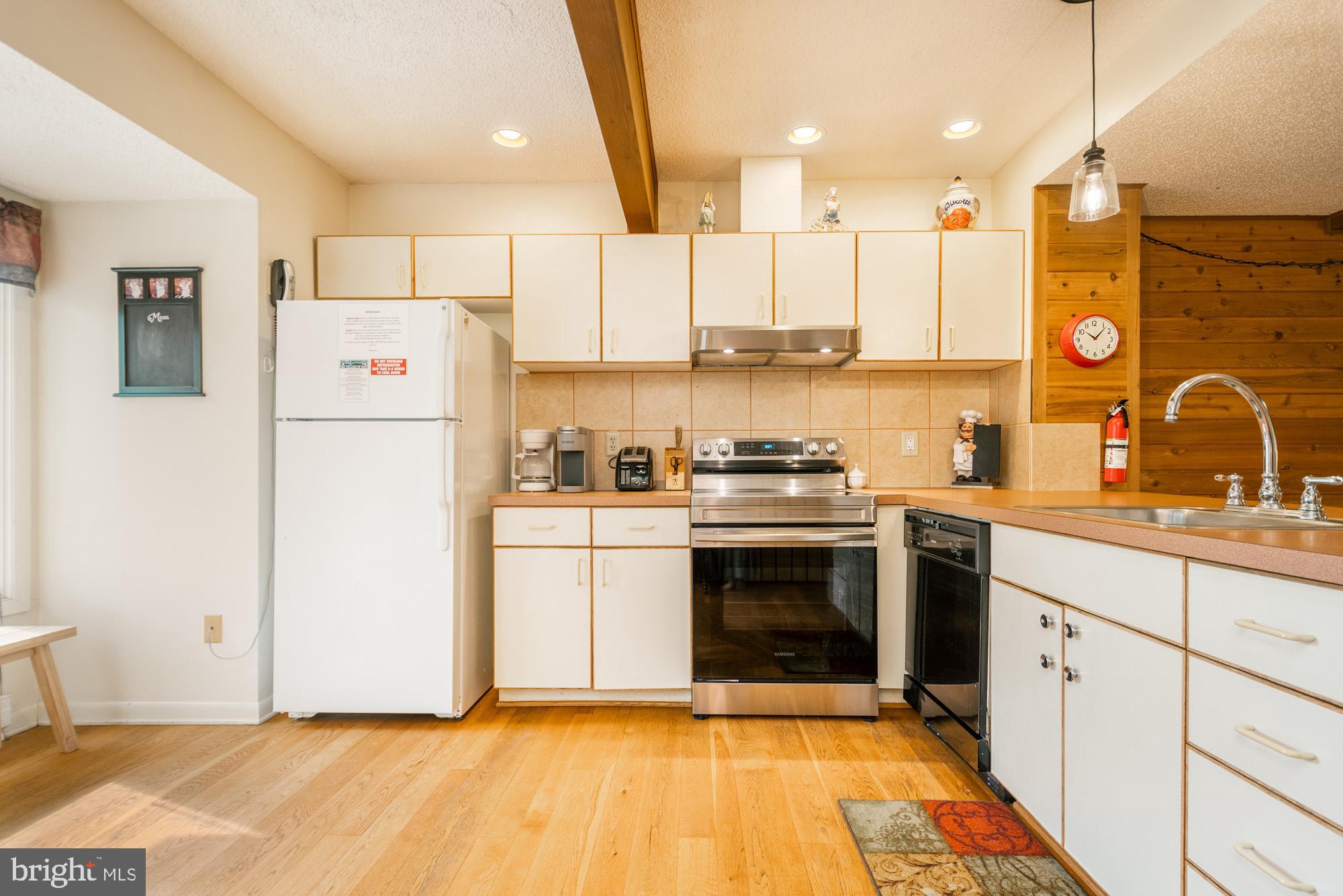18 Winding Way, Unit 18D McHenry, MD 21541 - Photo 12 of 48 a kitchen with a refrigerator and a sink