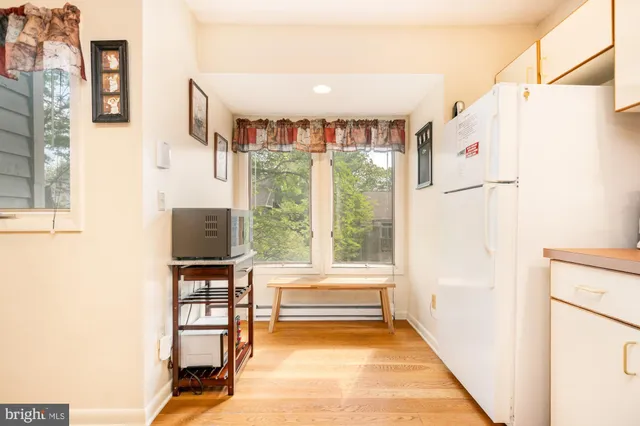 a bathroom with a bathtub and a window