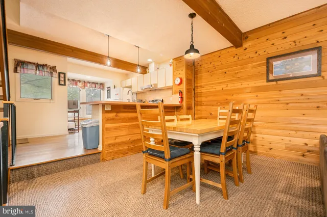 a bedroom with furniture and a wooden floor