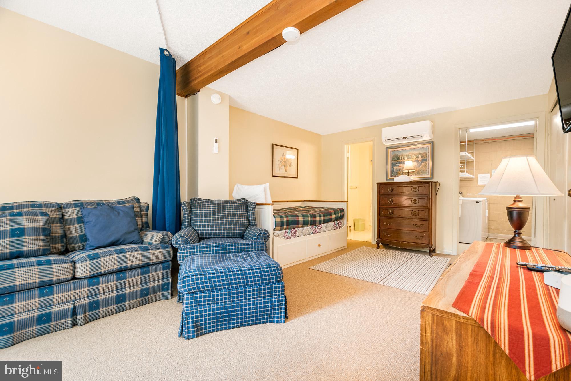 18 Winding Way, Unit 18D McHenry, MD 21541 - Photo 20 of 48 a bedroom with furniture and a wooden floor