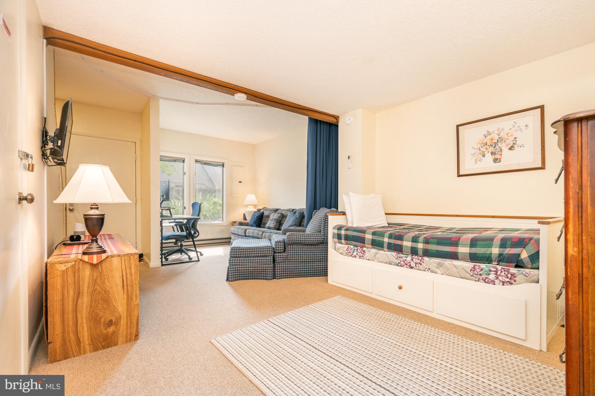 18 Winding Way, Unit 18D McHenry, MD 21541 - Photo 25 of 48 a living room with furniture and a large mirror