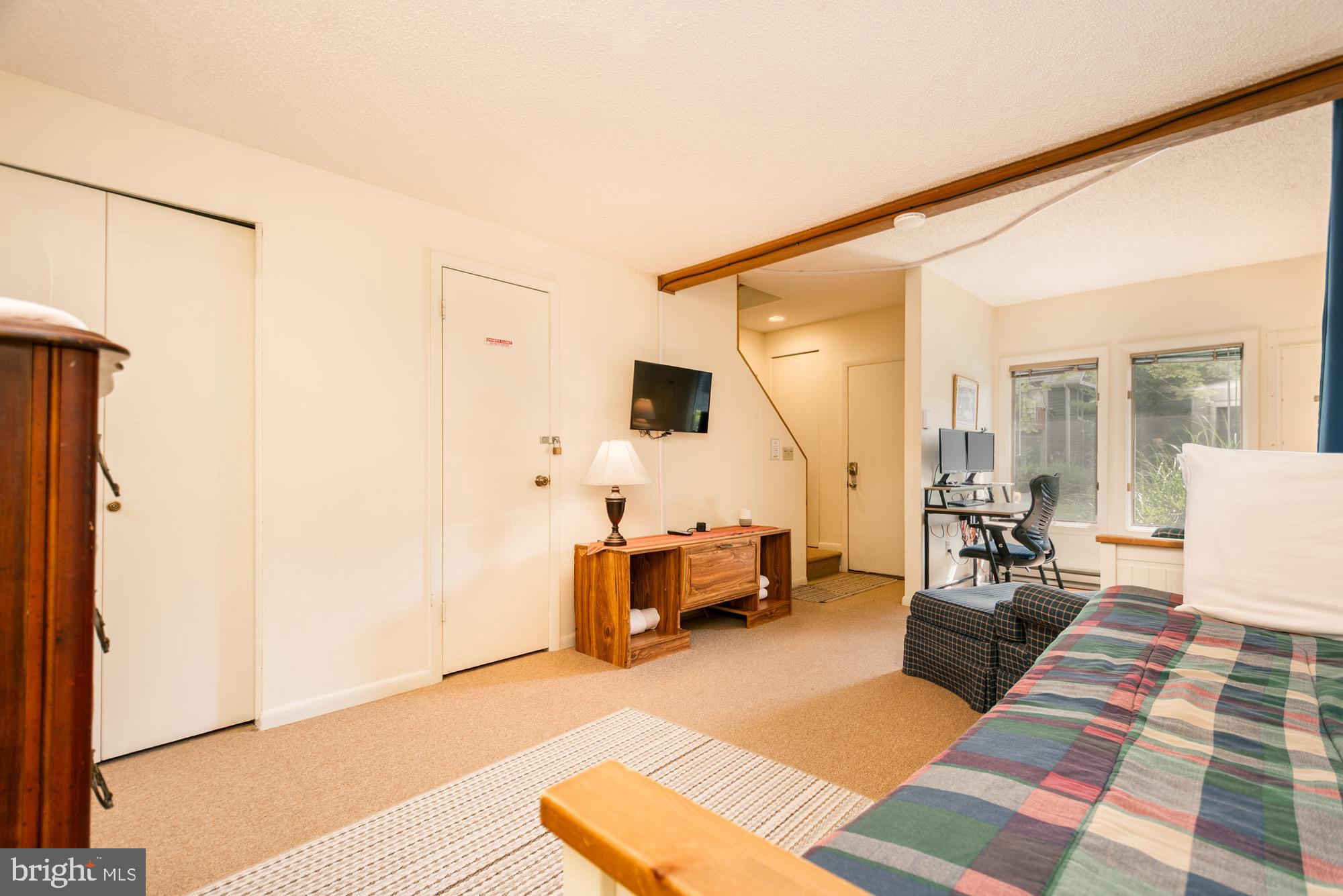 18 Winding Way, Unit 18D McHenry, MD 21541 - Photo 26 of 48 a living room with furniture and a flat screen tv