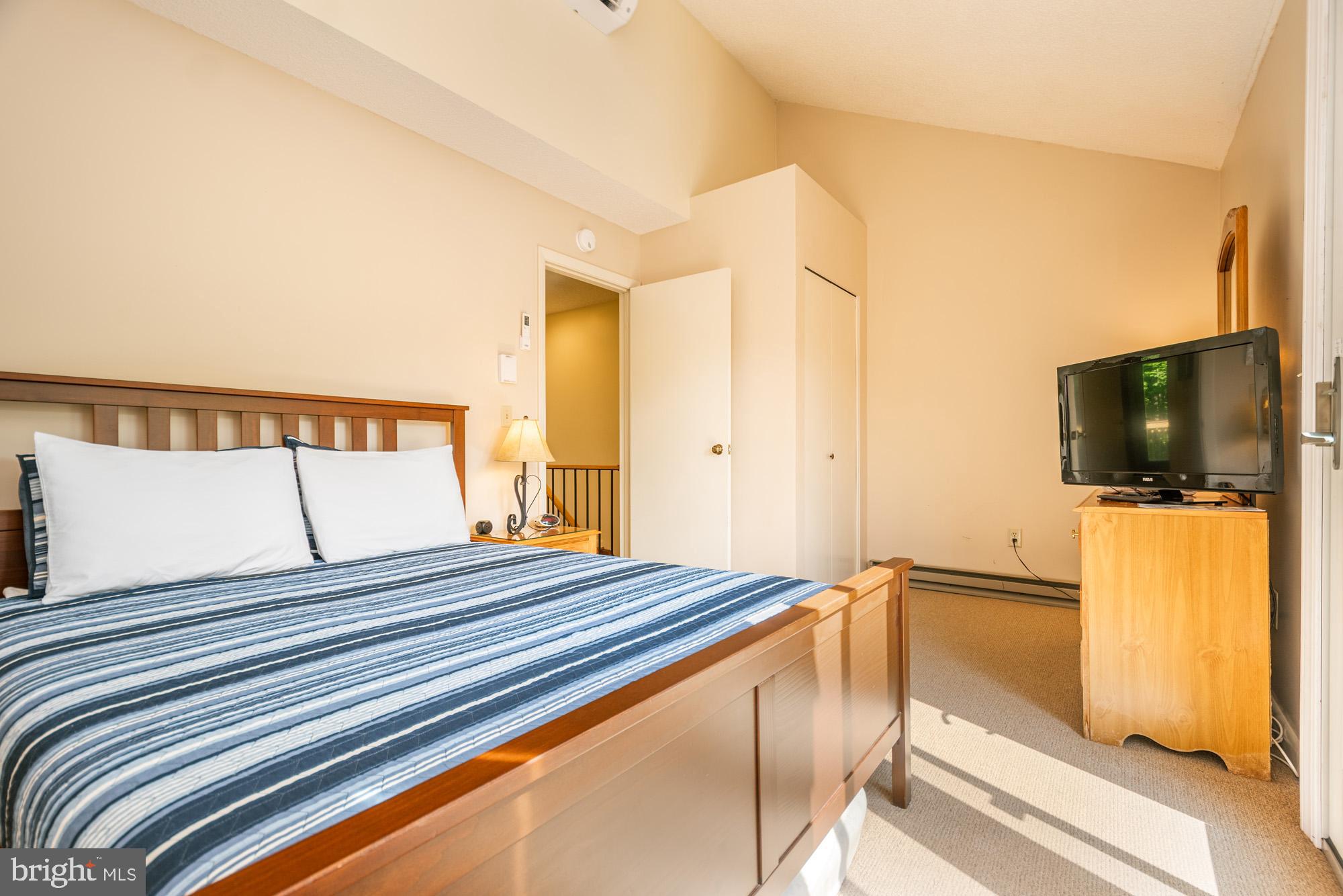 18 Winding Way, Unit 18D McHenry, MD 21541 - Photo 31 of 48 a bedroom with a bed and a flat screen tv