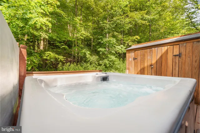 a view of a chairs and table on the wooden floor