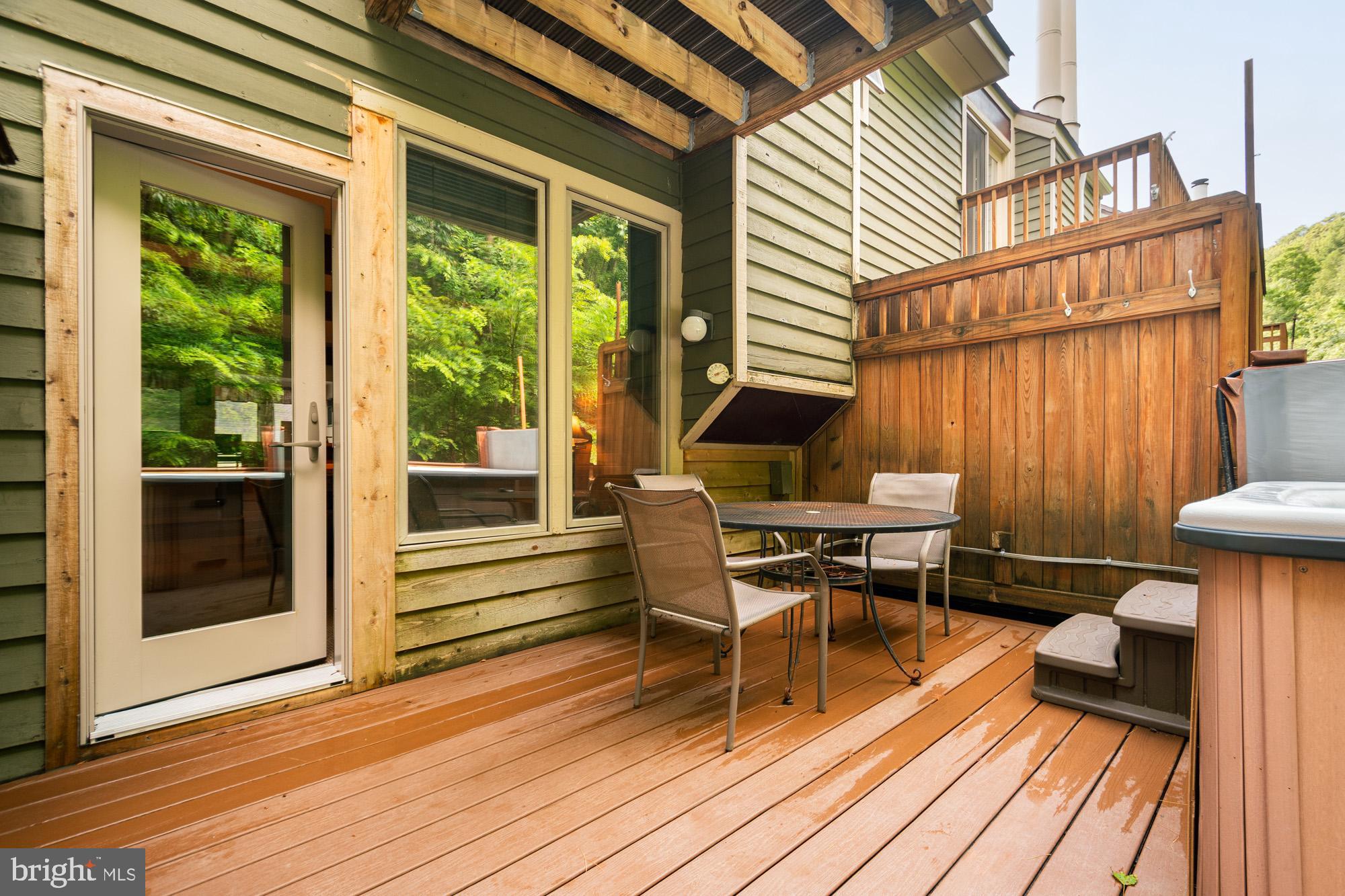 18 Winding Way, Unit 18D McHenry, MD 21541 - Photo 40 of 48 a balcony with wooden floor and furniture