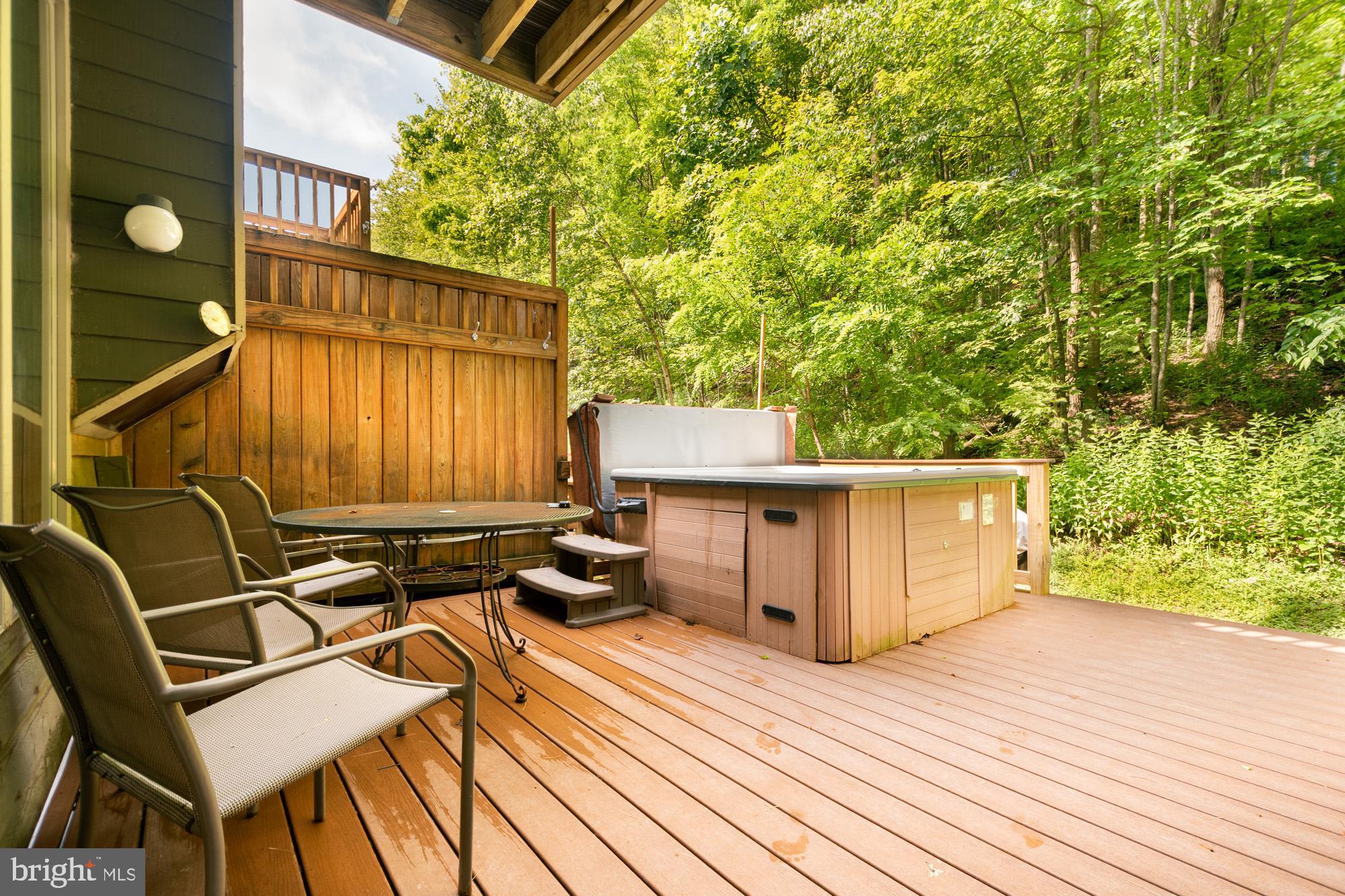 18 Winding Way, Unit 18D McHenry, MD 21541 - Photo 41 of 48 a view of a chairs and table on the wooden floor