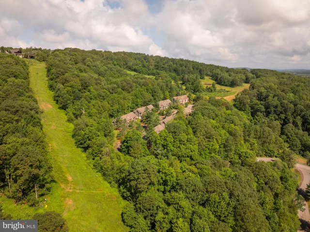 a view of a lake with a building in the background