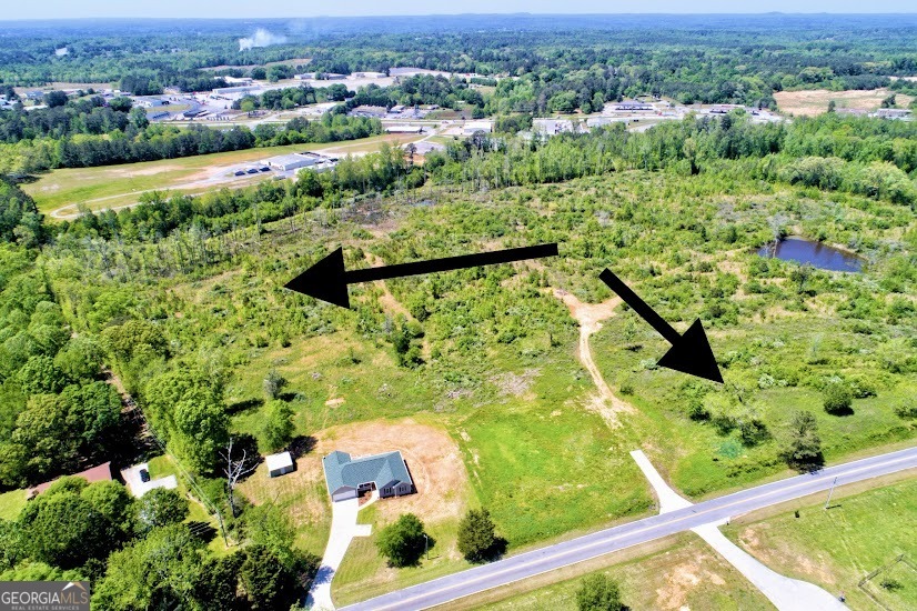 0 Folds Road, Unit TRACT B Carrollton, GA 30116 - Photo 1 of 1 an aerial view of residential houses with outdoor space and trees