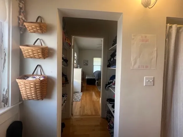 a living room with a bed furniture and a window