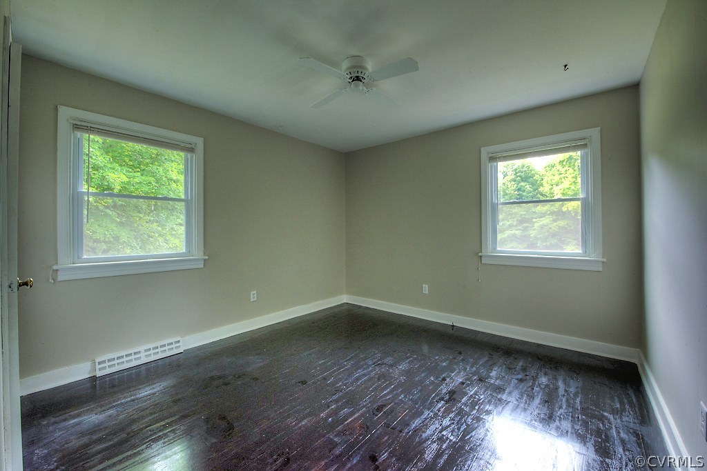 1267 Cardwell Road Crozier, VA 23039 - Photo 17 of 24 a view of room with window and hardwood floor