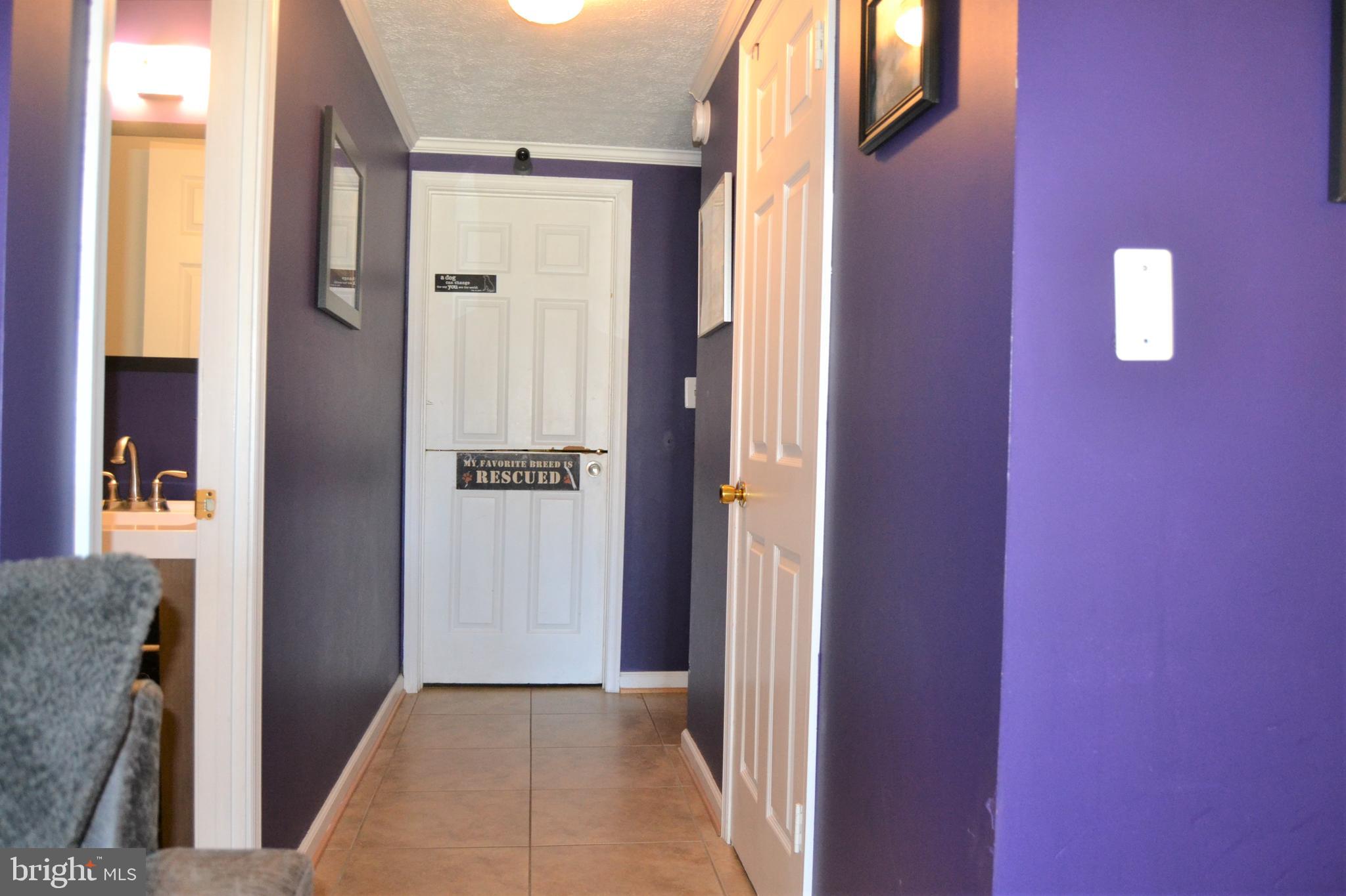 1067 Downton Road Baltimore, MD 21227 - Photo 32 of 47 Hall to spacious storage and laundry