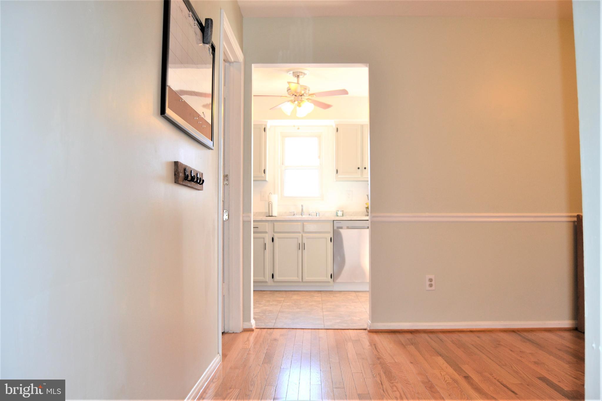 1067 Downton Road Baltimore, MD 21227 - Photo 6 of 47 Through dining room to kitchen