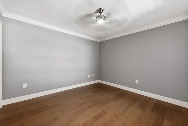 a view of a room with wooden floor