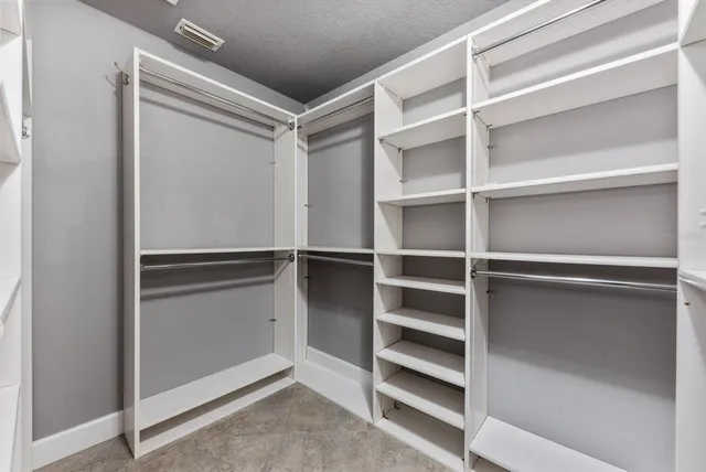 a view of an empty walk in closet