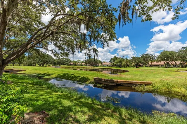 a view of a lake with houses in the background